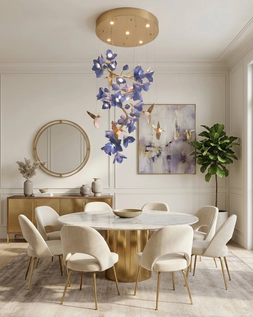 Purple ceramic floral chandelier with copper hummingbird accents above round dining table