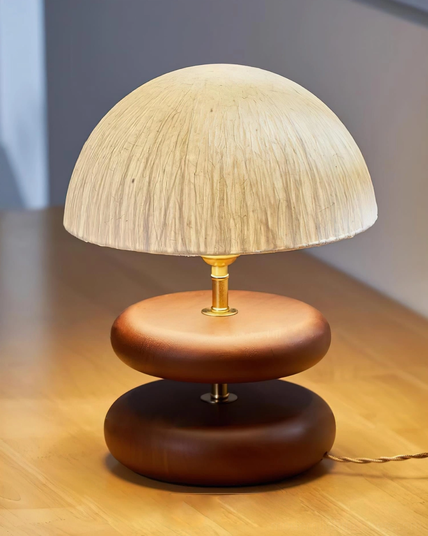 Wood base table lamp with brass metal connecting hardware rice paper shade contemporary interior accent