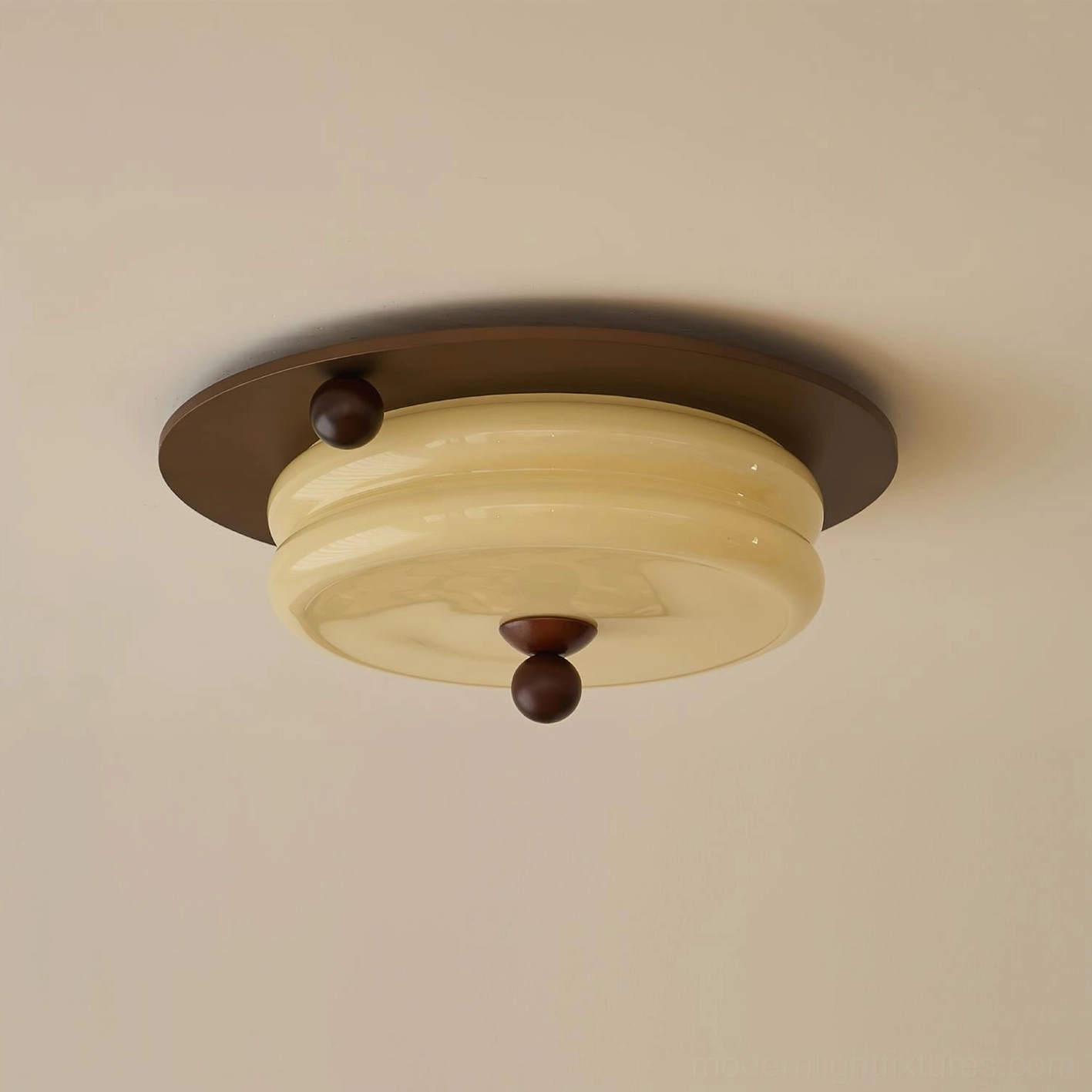 Close-up detail of beige glass shade and dark brown wood base on warm toned background