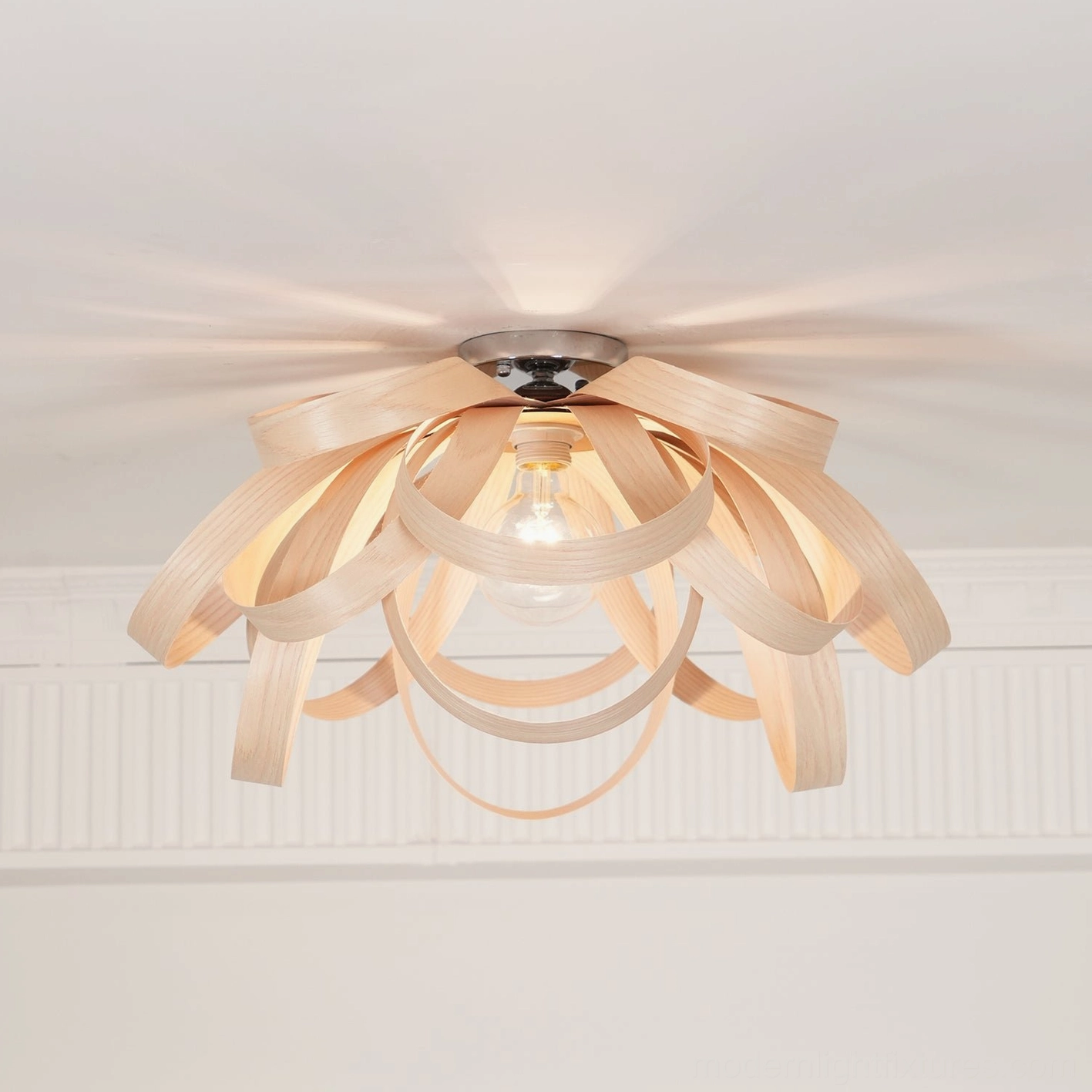 Compact wooden petal ceiling light with chrome metal base mount detail