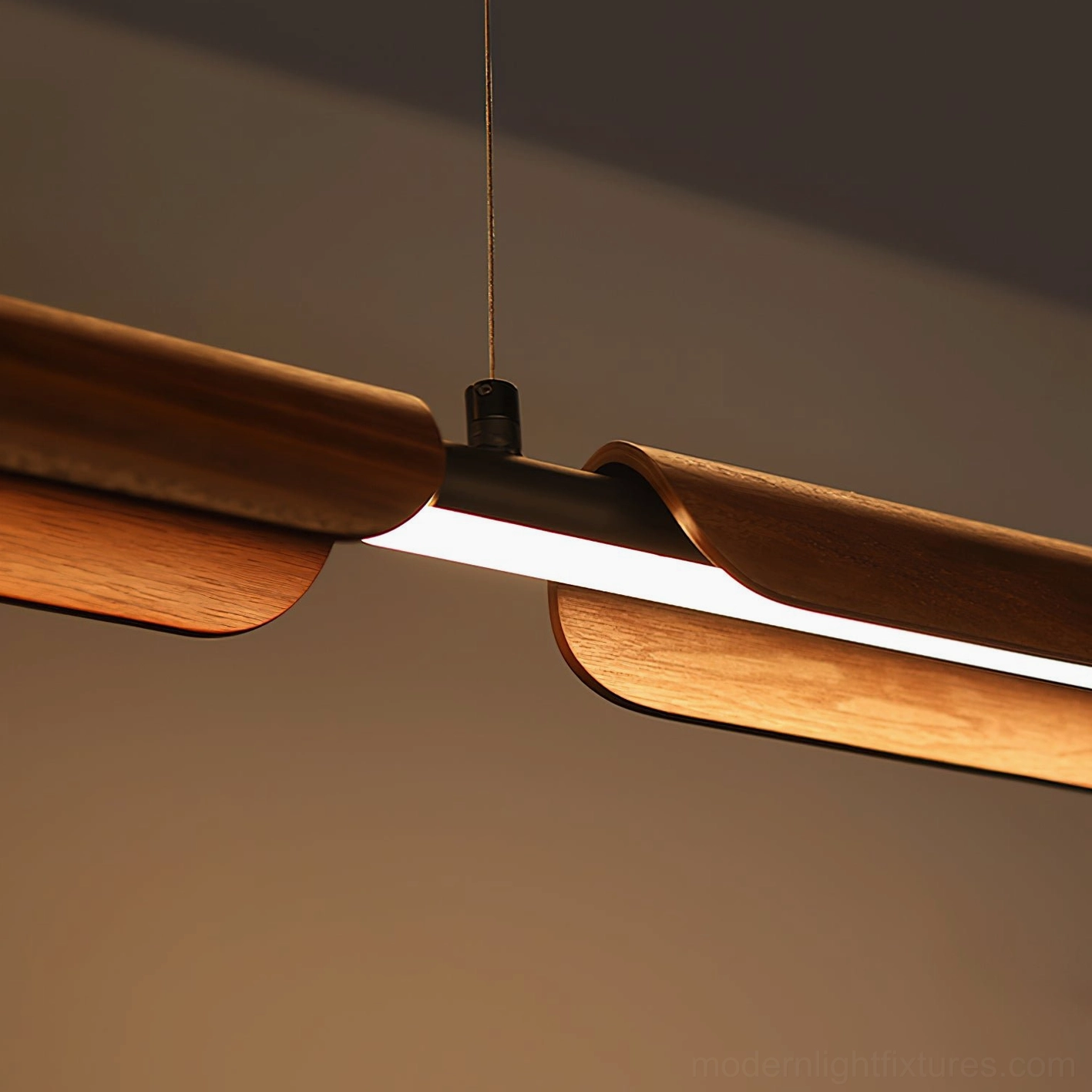 Close-up detail of wood chandelier showing walnut veneer, integrated LED light strip, and black metal hardware