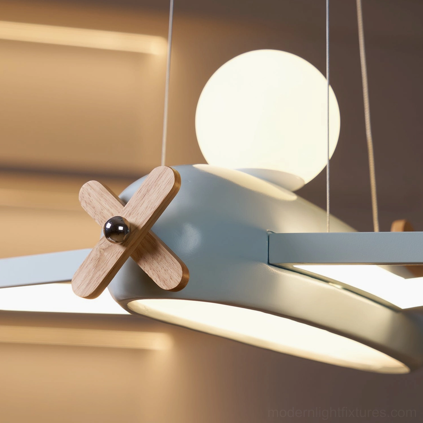 Wood color airplane pendant lamp in natural finish complementing warm earth tone children's room color palette