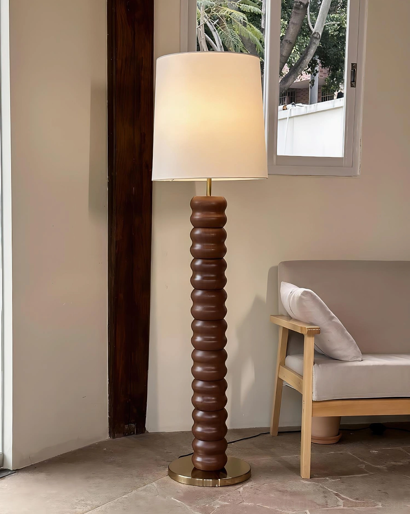Stacked wood floor lamp architectural design detail showing wooden rings and metal base construction