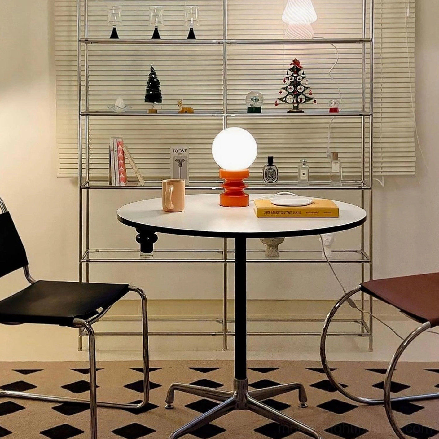 Contemporary glass and wood table lamp in small apartment dining area setting