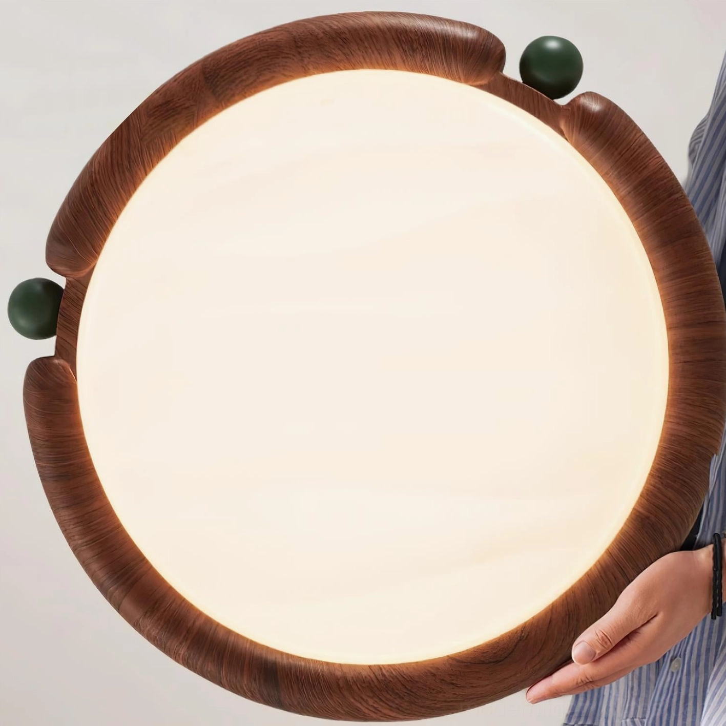 Close-up detail view of wood-grain ceiling light showing authentic texture and green decorative knobs