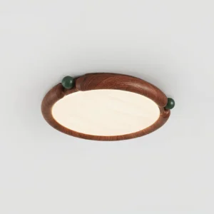Contemporary wood-grain flush mount ceiling light fixture with dark green accent knobs, angled product photography