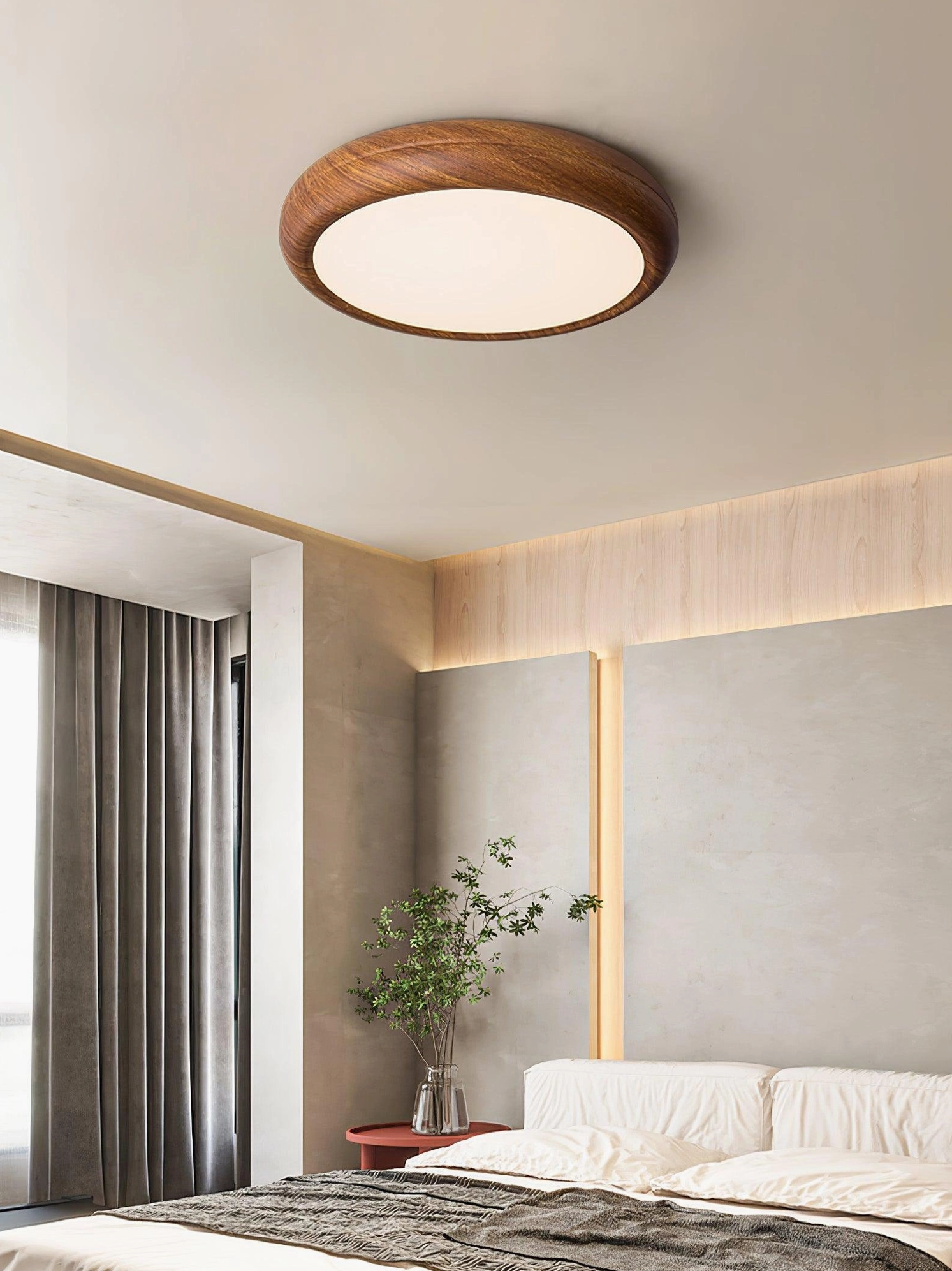 Wood grain round flush mount ceiling light creating soft ambient lighting in residential bedroom space