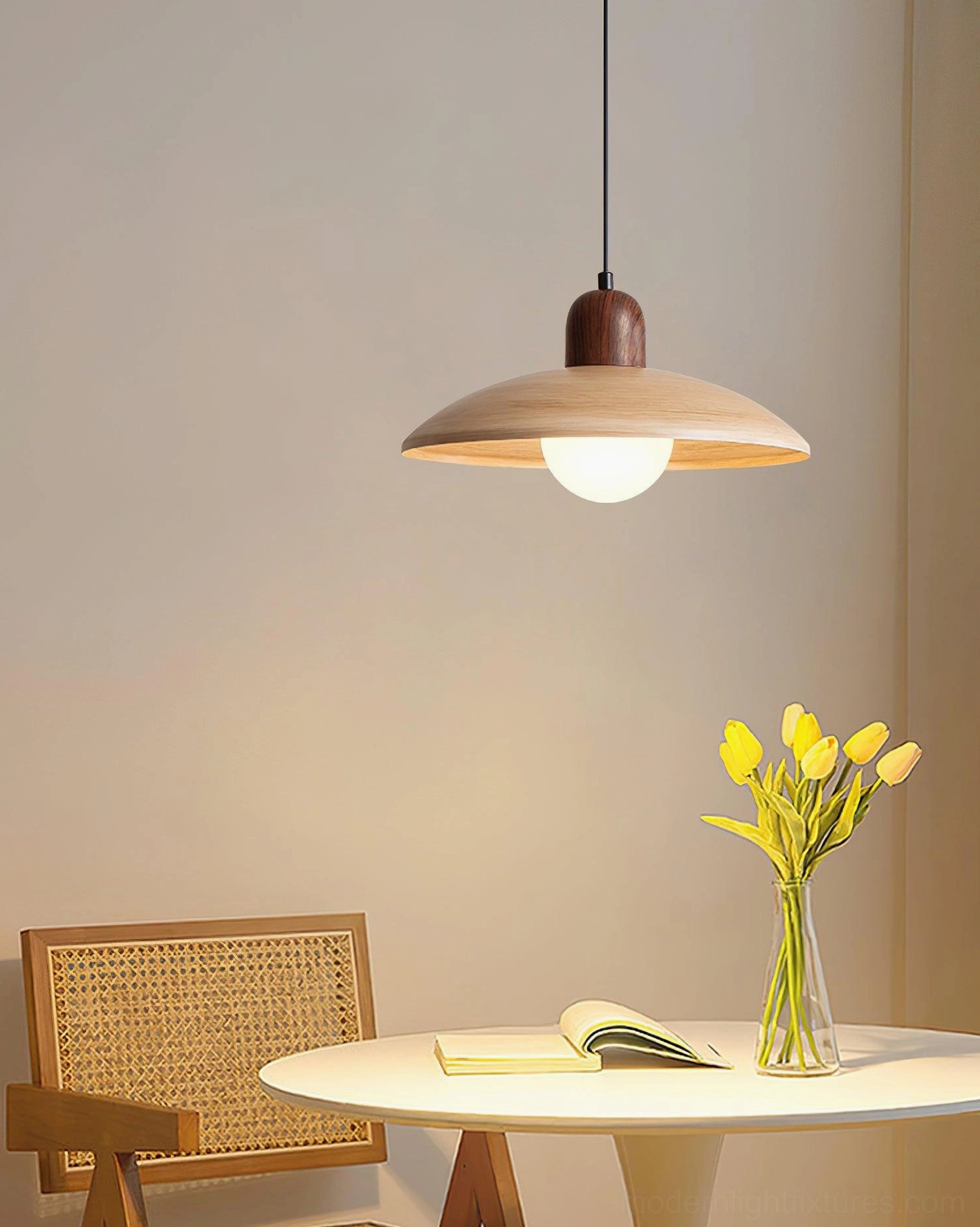 Contemporary wood pendant lamp with glowing LED bulb in small dining corner nook