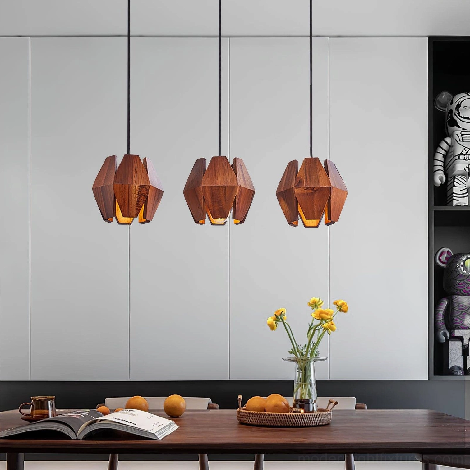 Modern pendant lamp with gold metal accents and natural wood shade in minimalist setting