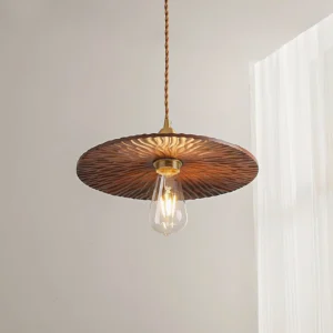 Radial carved wood pendant lamp with twisted golden cord - three-quarter perspective