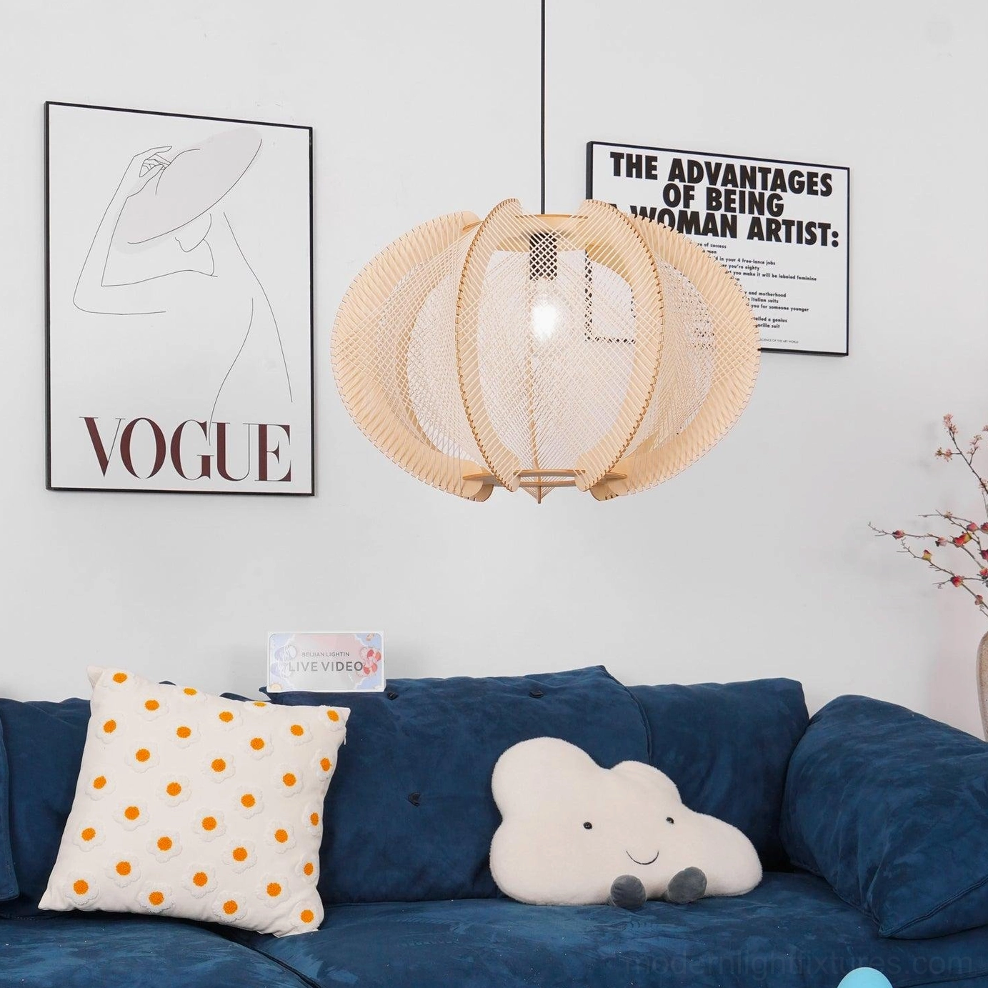Wood pendant light with white fabric panels in contemporary interior setting