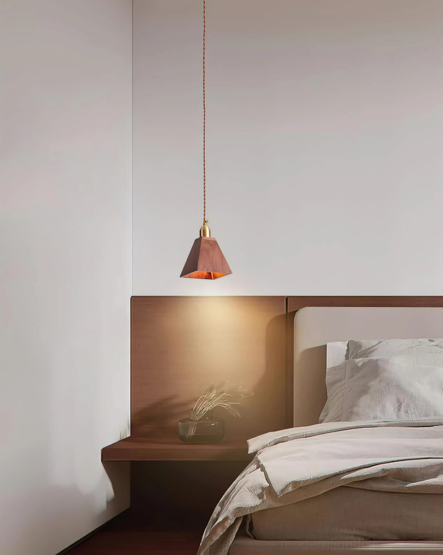 Three wood pendant lights in varied finishes arranged for comparison