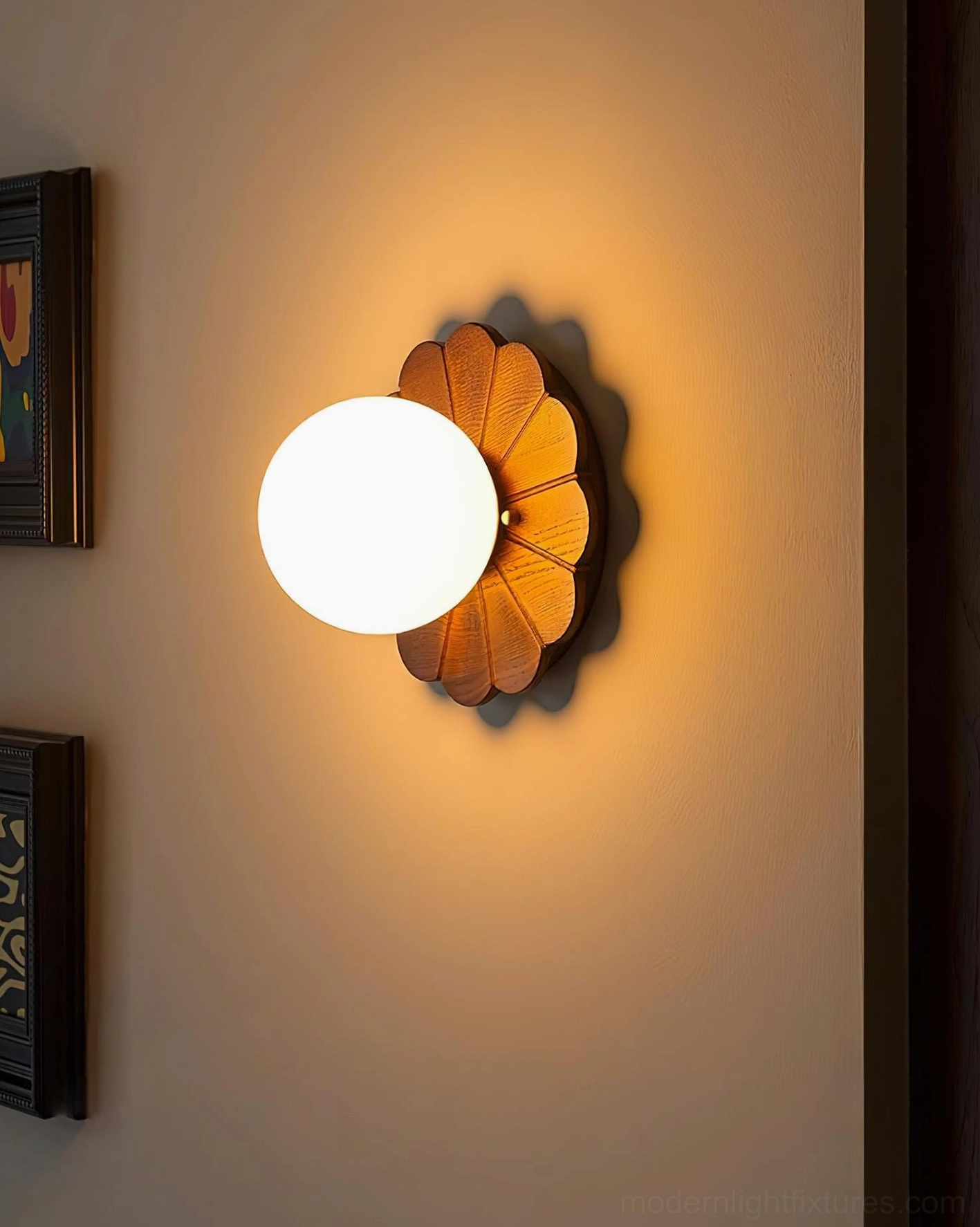 Illuminated botanical wall sconce in retro home entryway with warm ambient light and gallery wall art