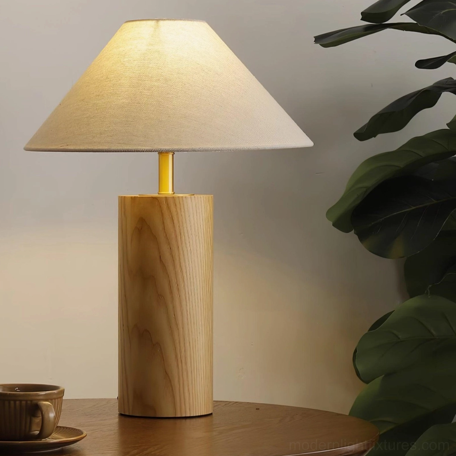 Modern cylindrical wooden table lamp with textured beige fabric shade and metallic stem