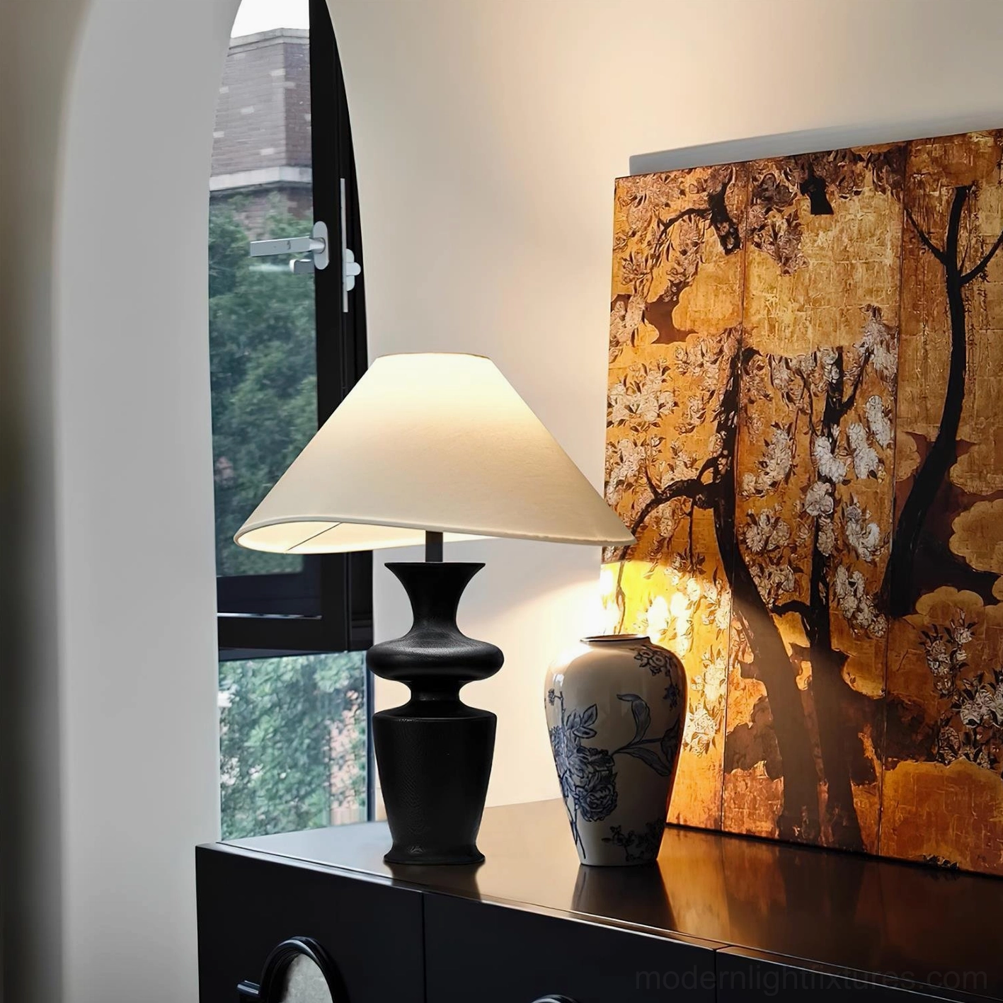 Modern wood table lamp displayed on dark wooden side cabinet at eye level, creating warm ambient light in oriental vintage home decor interior