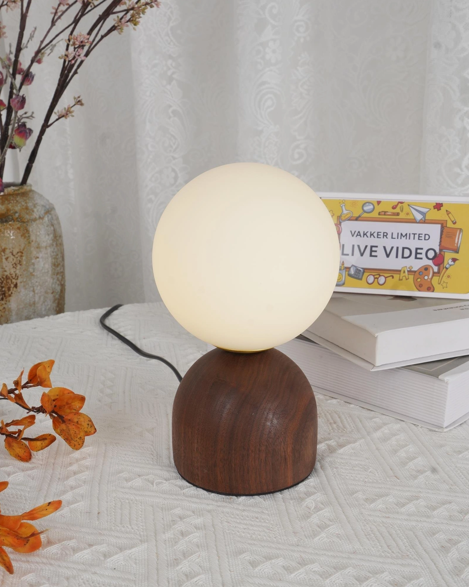 Modern wood knuckle table lamp frosted glass shade close-up detail shot showing craftsmanship