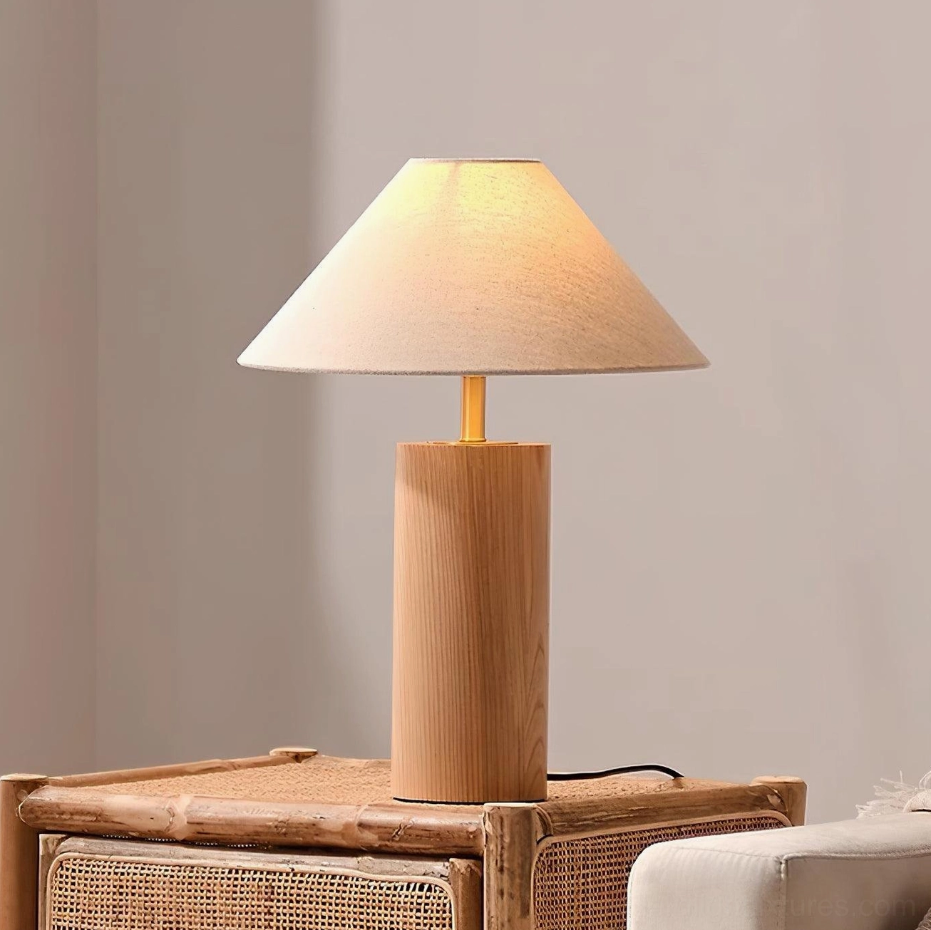 Natural finish wooden table lamp on rattan woven side table with warm neutral home decor