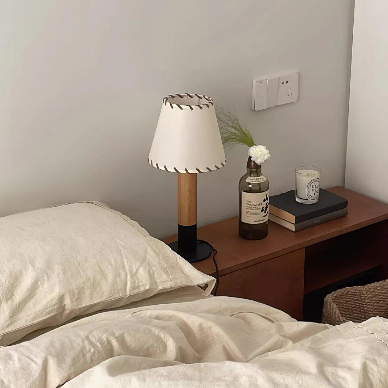 Harmonie wood table lamp three-quarter view showing natural wood base and fabric shade construction