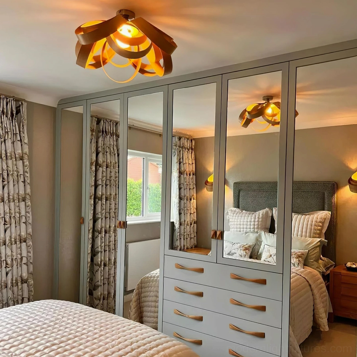 Modern semi-flush wood light fixture installed in master bedroom overhead view