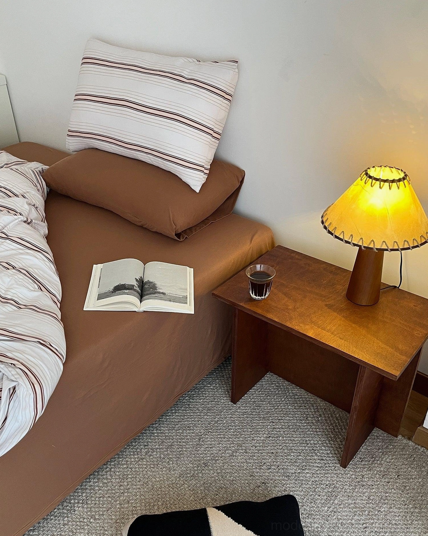 Wooden lamp with hand-knotted jute shade in home office setting showing workspace lighting solution