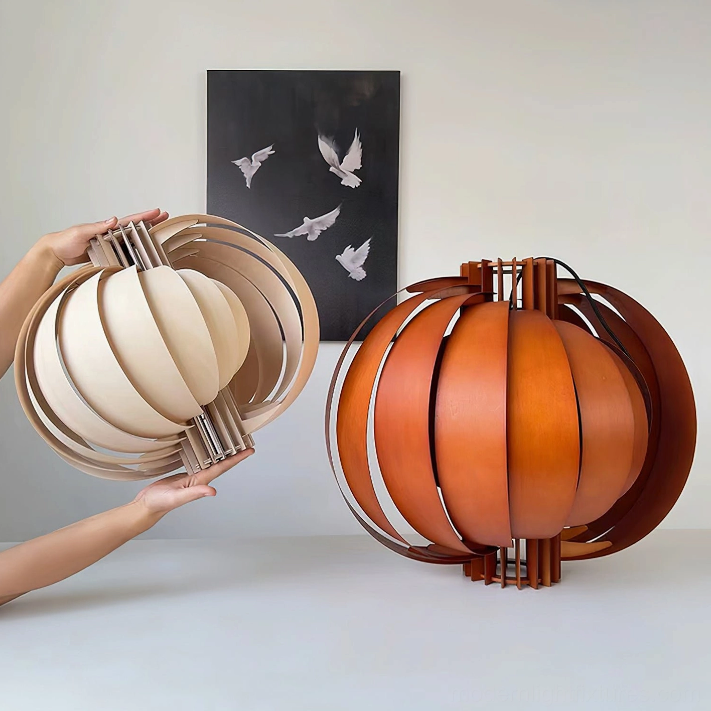 Natural wood and walnut wooden lantern pendants side by side, showing both color options for comparison