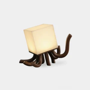 Sculptural wooden octopus table lamp with carved tentacle base and cream alabaster cube diffuser, front low-angle studio view