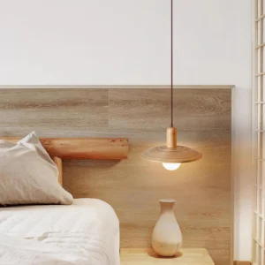 Wooden pendant lamp in bedroom with rustic wooden headboard, providing warm ambient lighting for bedside setting