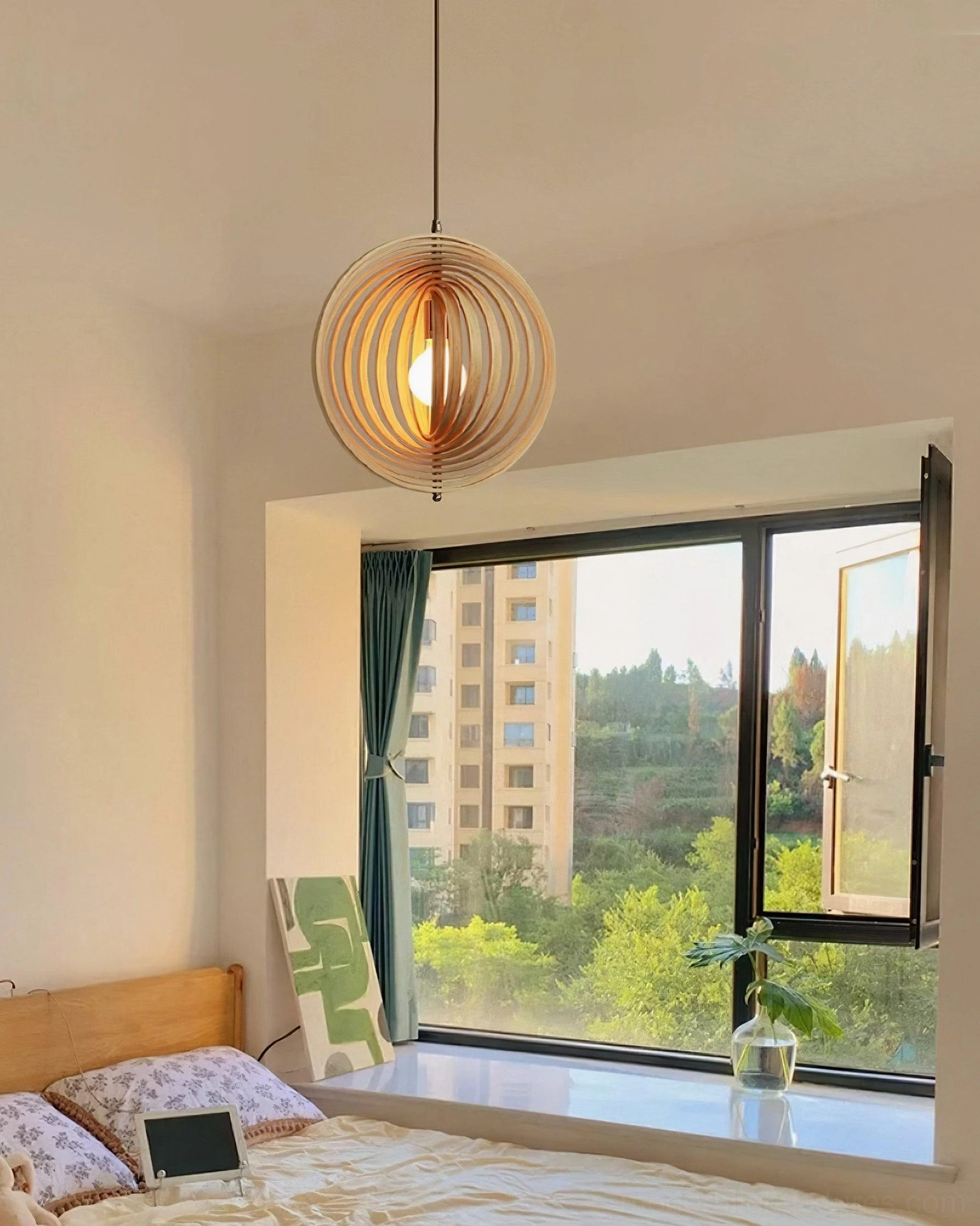 Wooden sphere pendant light installation detail showing metal framework and wood construction