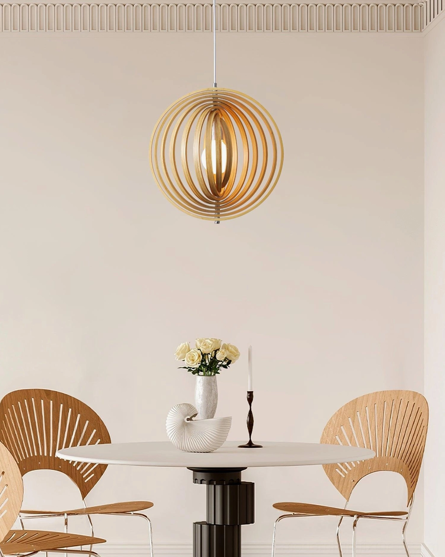 Eye-level view of glowing wooden sphere pendant lamp in small modern dining nook with illuminated interior