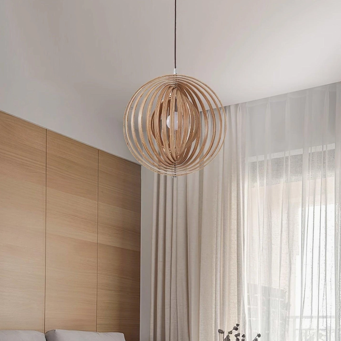 Wooden sphere pendant light over kitchen island providing focused ambient task lighting in modern kitchen