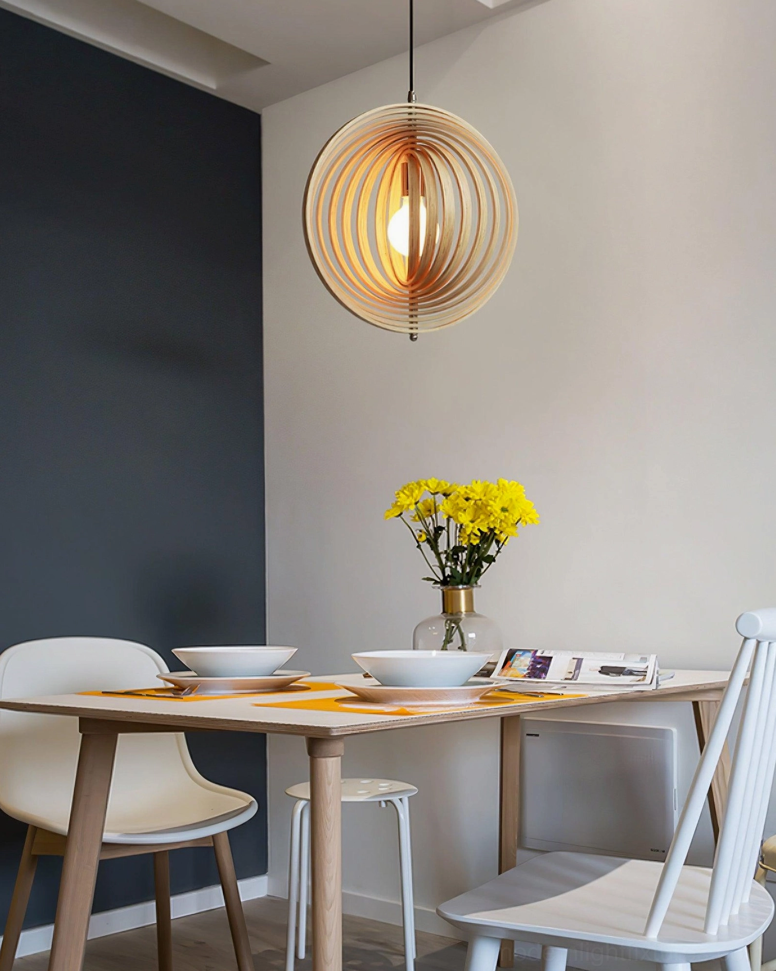 Wooden sphere pendant light installed in rustic contemporary dining space with warm wood tones