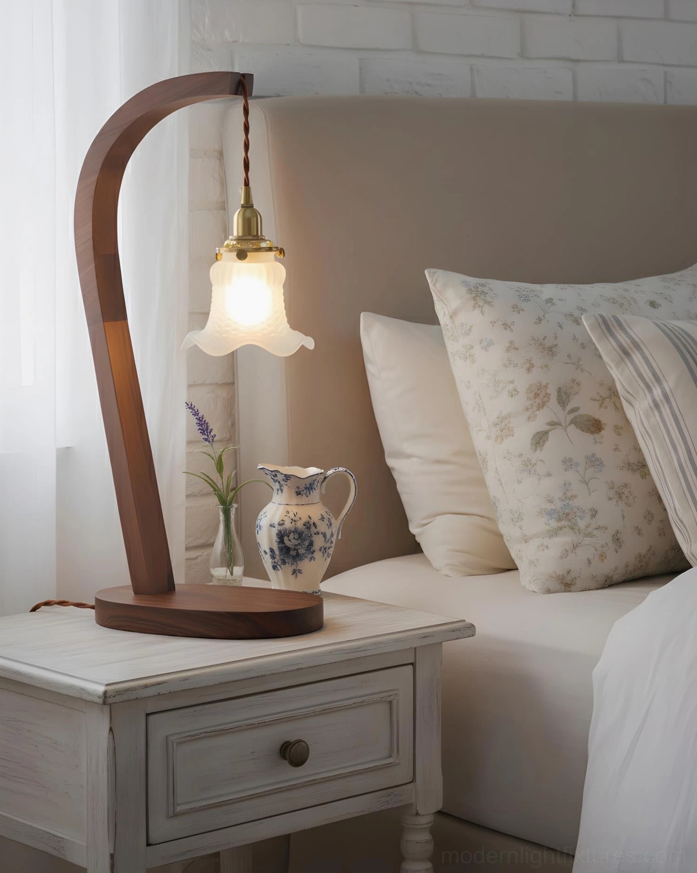 Farmhouse style walnut wood table lamp on bedside table with floral bedding
