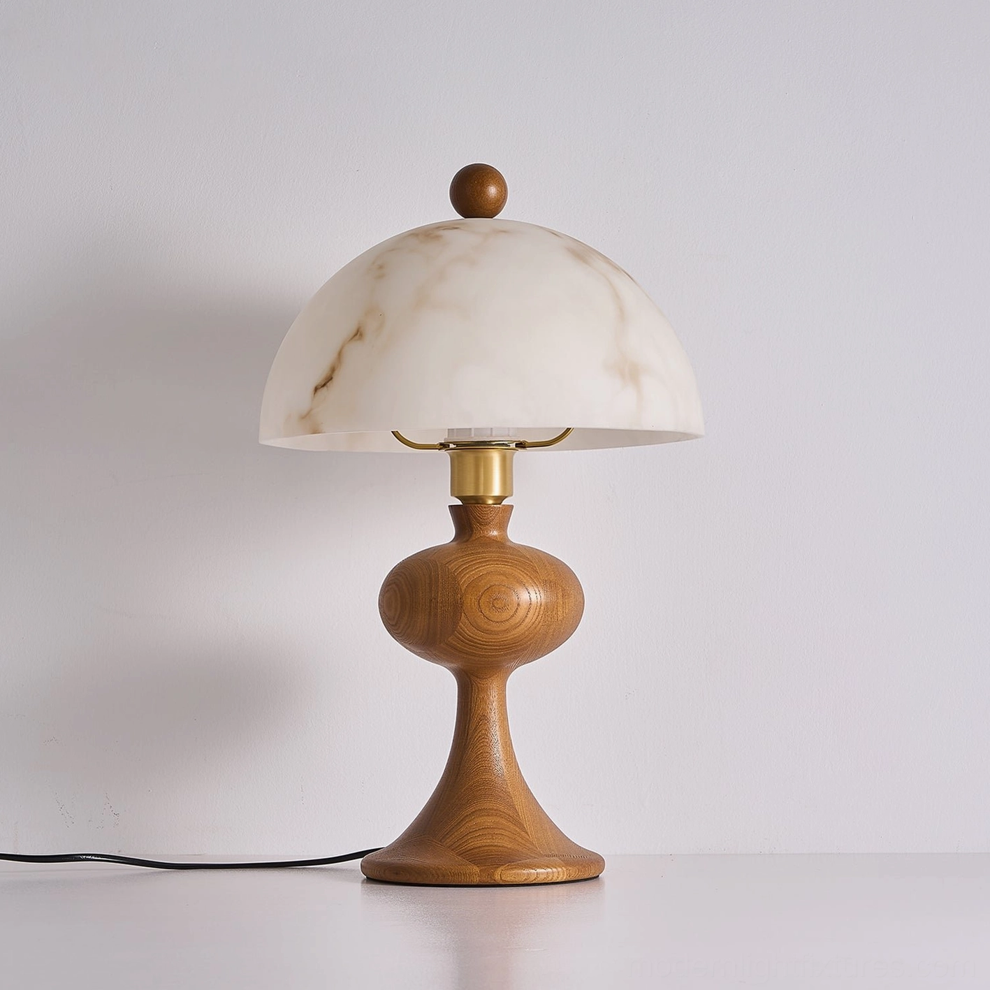 Unlit walnut wood table lamp with turned base and power cord, front view showcasing classic mid-century modern form