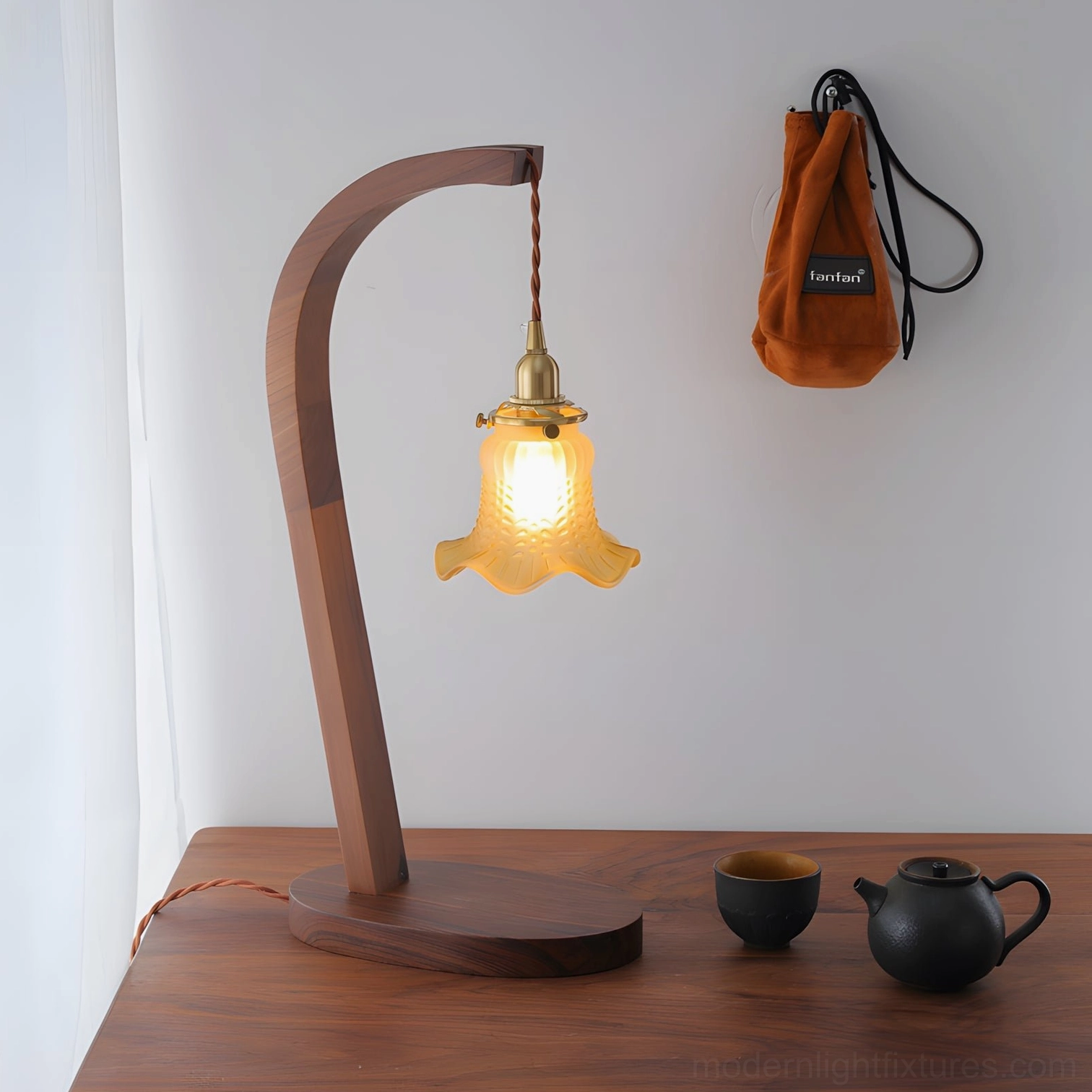 Wooden table lamp with warm yellow shade walnut base transitional design