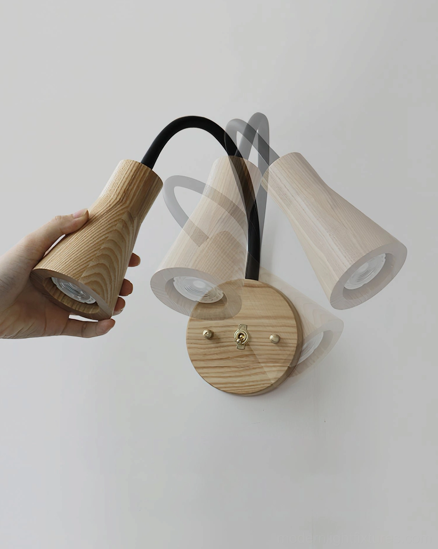 Wooden wall lamp with black flexible gooseneck arm, natural wood grain visible, handheld showcase