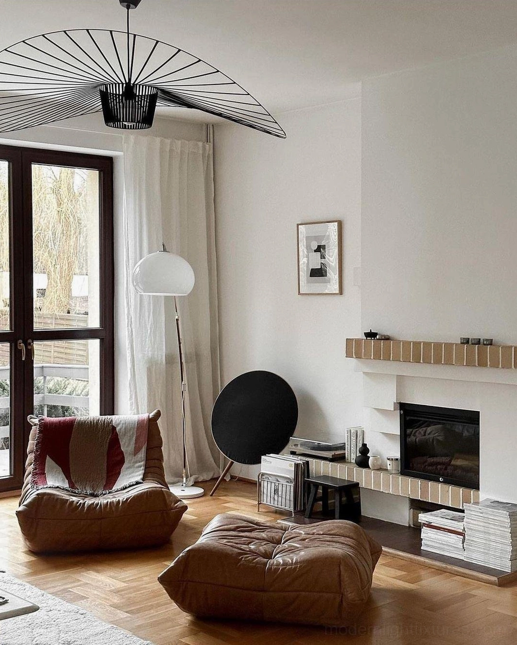 Multiple sizes of woven fiber glass pendants displayed together showing scale comparison