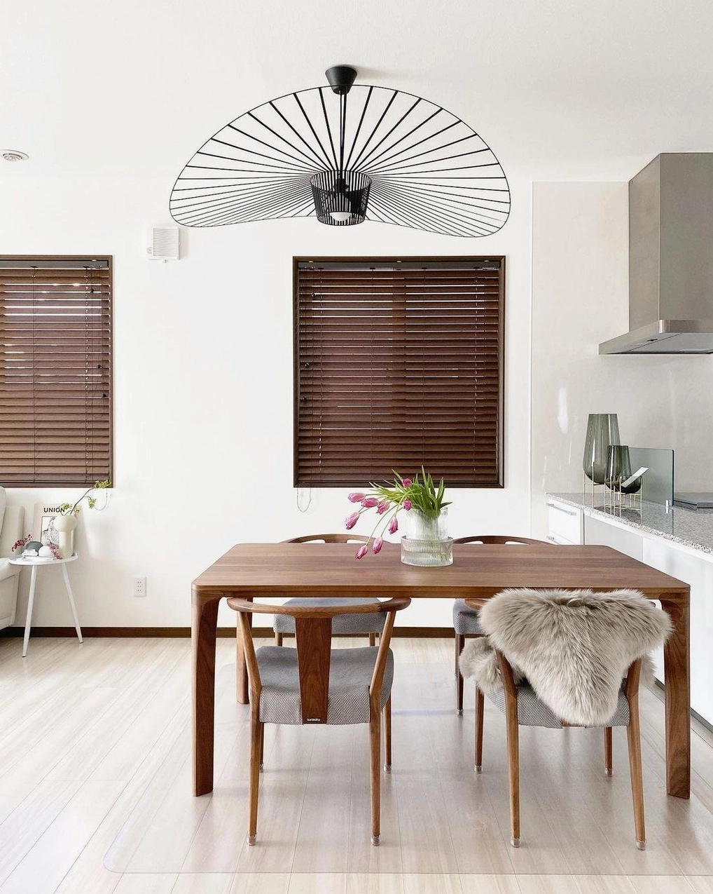 Black and brown color options of woven fiber glass pendant lamp side by side comparison