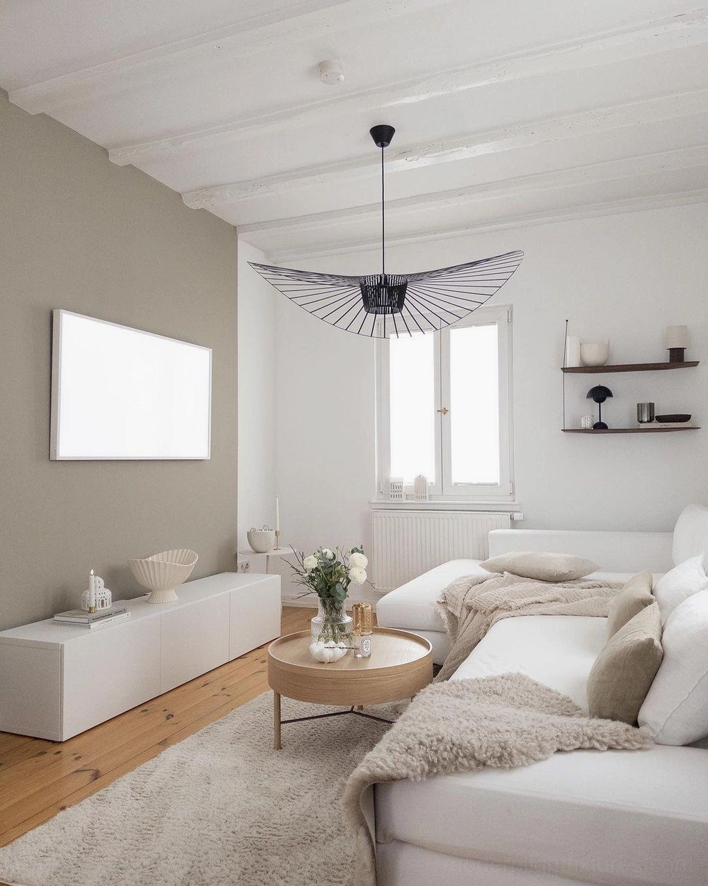 Black woven fiber glass pendant installed on sloped ceiling demonstrating angle compatibility