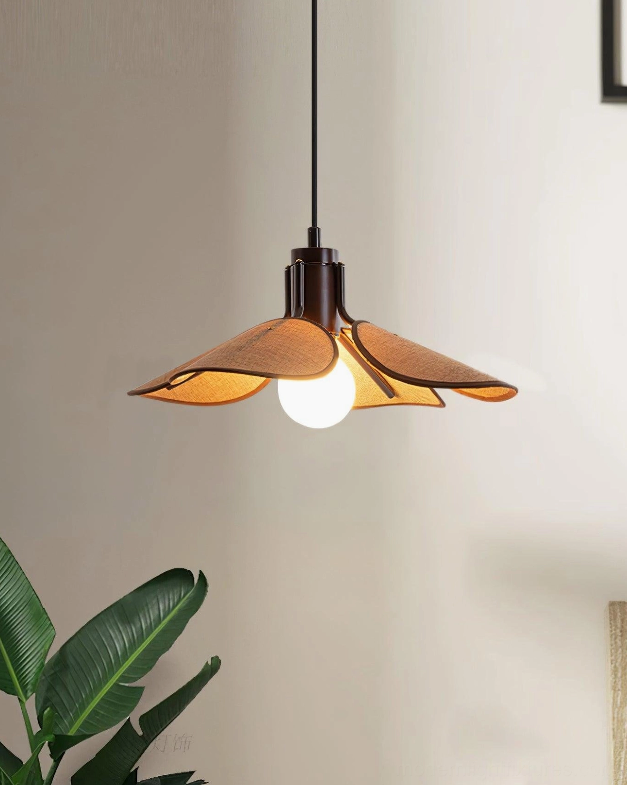 Hand-woven rattan flower pendant featuring tan fabric petals and dark brown metal fixture in modern living space