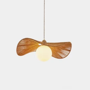 Coastal woven rattan pendant light with natural hemp rope shade and spherical bulb, overhead studio view