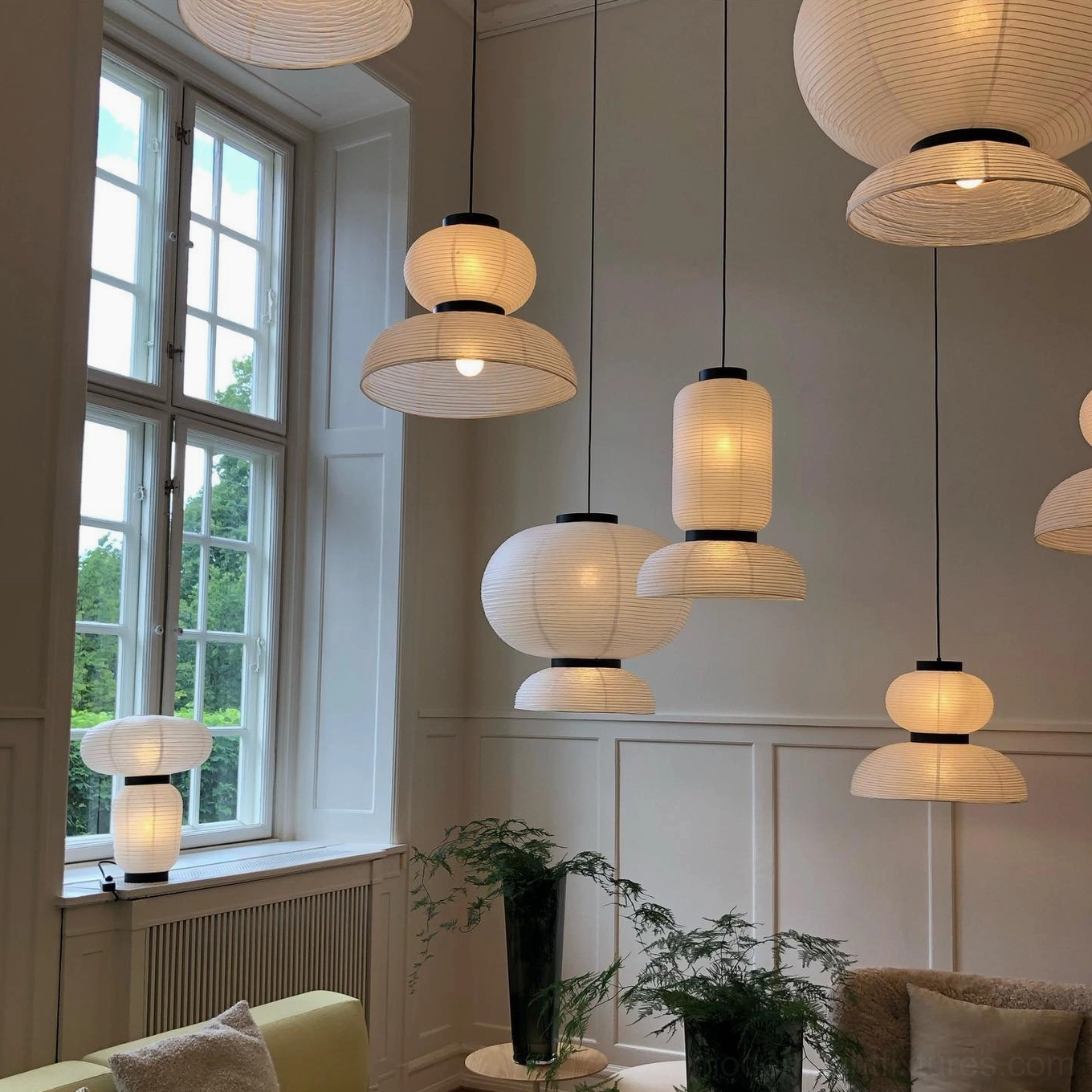 Multiple Xuan paper hanging lights creating layered ambient lighting in contemporary space