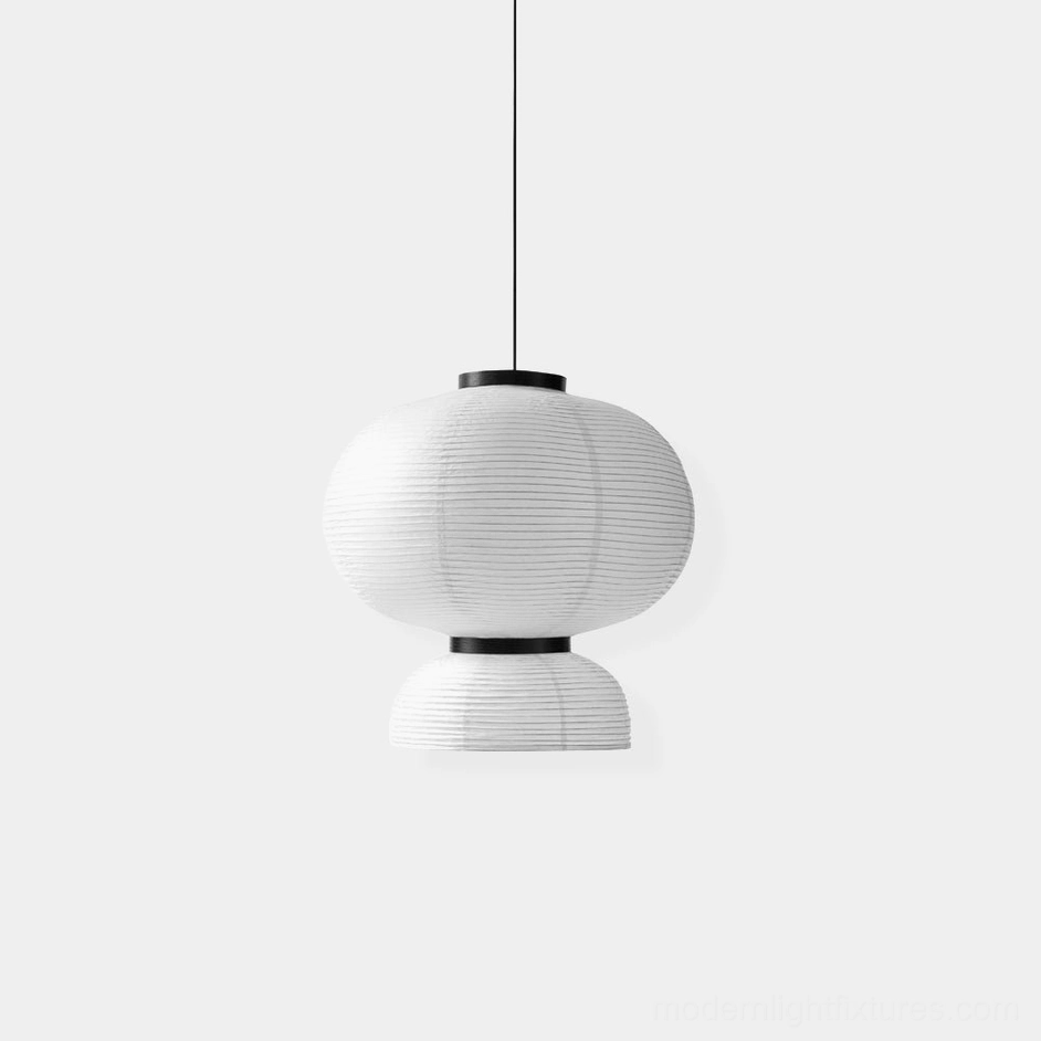 Handcrafted Xuan paper pendant lamp with pleated ivory white shade and black oak frame rings, frontal studio view