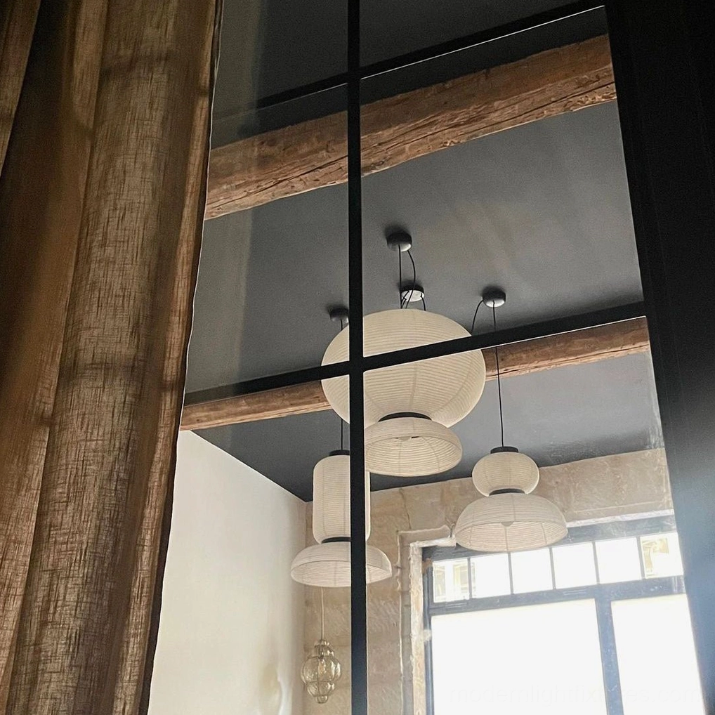 Xuan paper pendant lamp viewed through residential window, warm ambient interior lighting