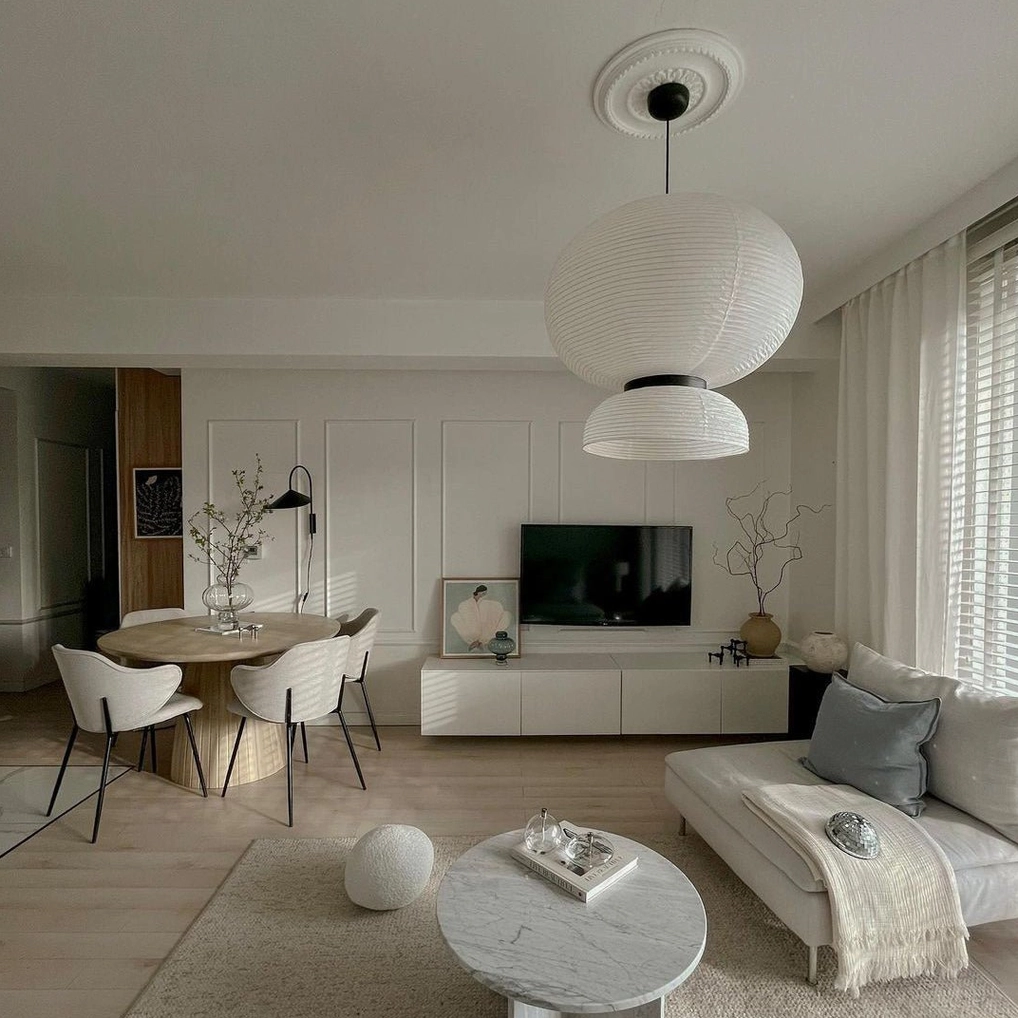 Multiple Xuan paper pendant lamps in coordinated installation for modern dining space