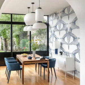 Multiple Xuan paper pendant lights installed in modern Nordic minimalist dining room with large windows