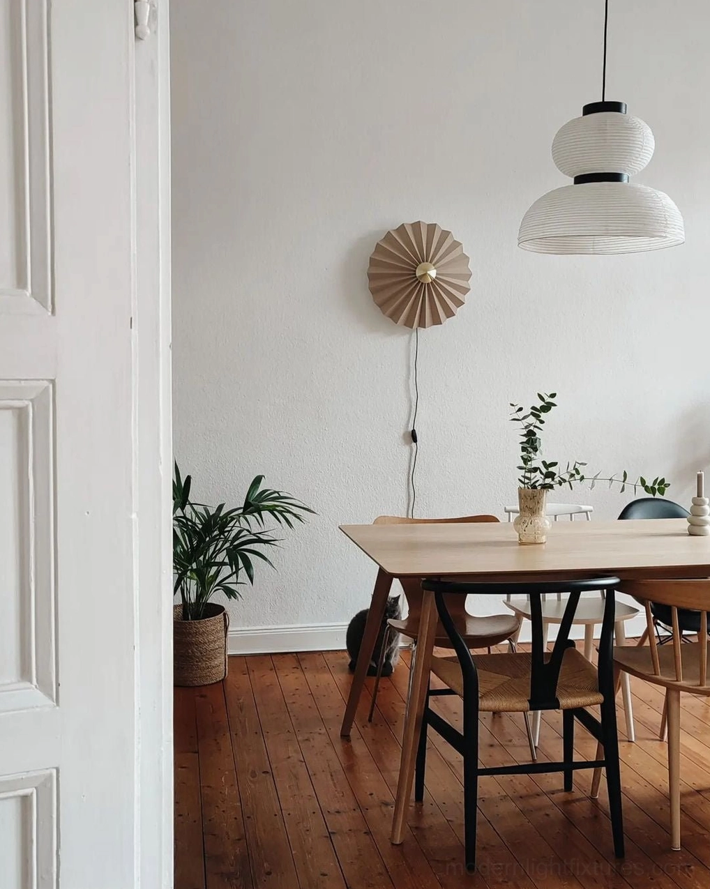 Tiered Xuan paper pendant light creating sculptural focal point in modern living room