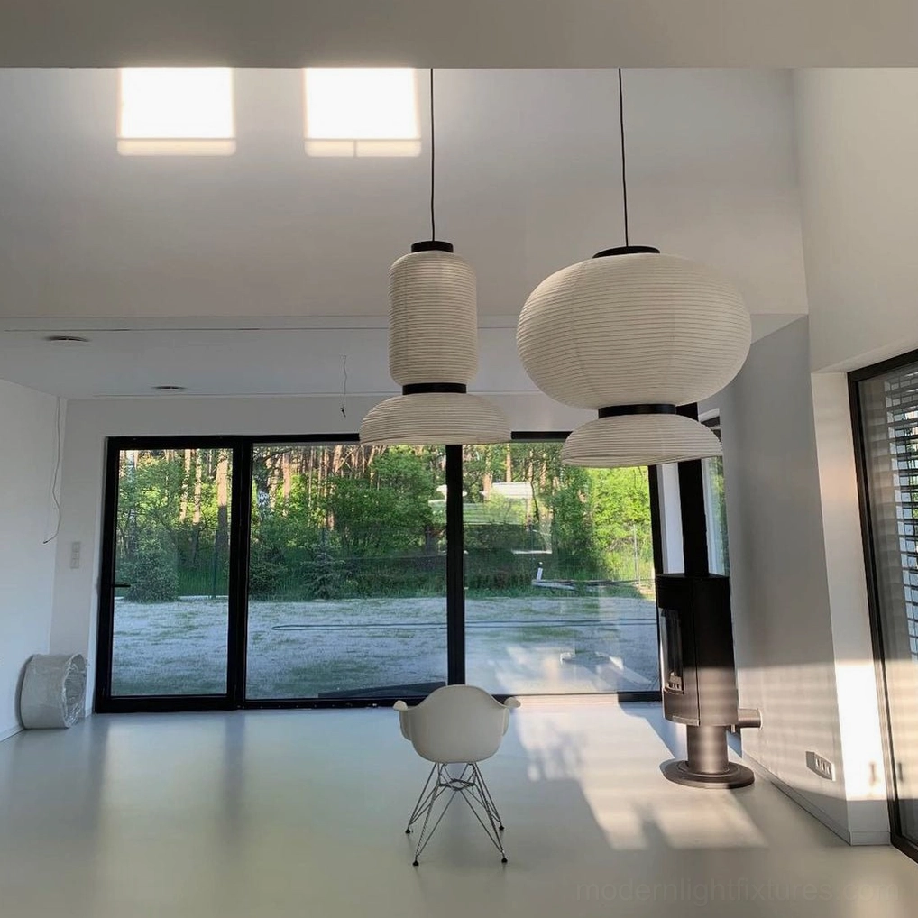 Single Xuan paper pendant lamp with ivory white shade and black oak rings, interior setting