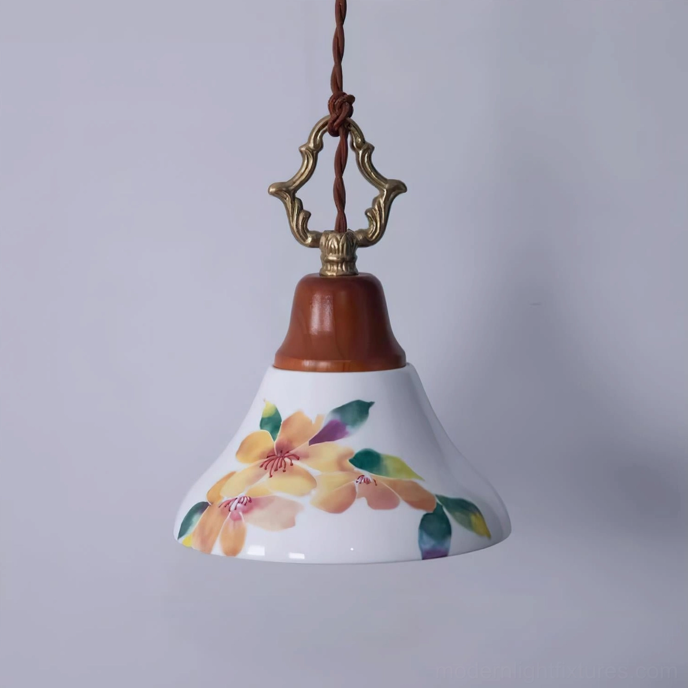 Yellow hand-painted azalea ceramic pendant light with warm floral print and brown wooden crown, front three-quarter view