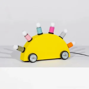 Yellow cartoon car table lamp side view with assorted colored bulb bases and power cord