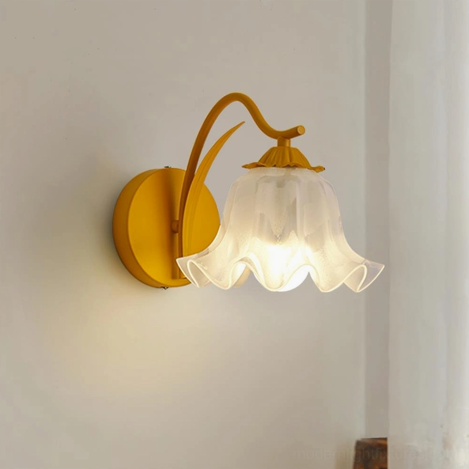 Yellow modern wall sconce with lily valley design - eye-level residential installation